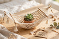 Mini desktop hammock, a tiny woven hammock on a desk stand